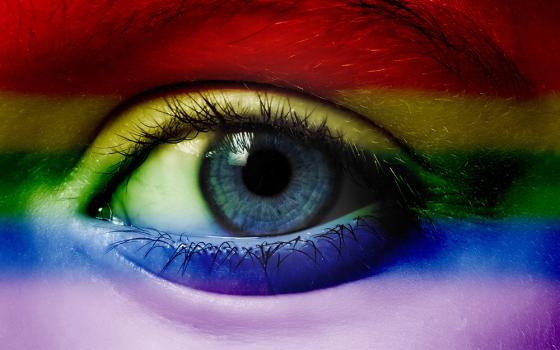 Human eye with an overlay of rainbow colors (Dreamstime/Verastuchelova)